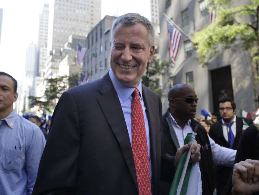 New York Mayor Bill de Blasio winking at someone