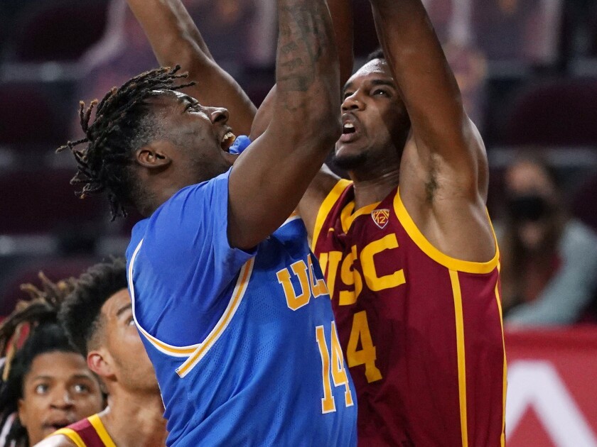 UCLA forward Kenneth Nwuba shoots in front of USC forward Evan Mobley.
