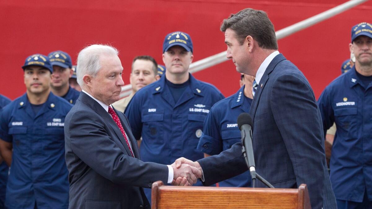 SAN DIEGO, CA.- Sept. 20, 2017, Congressman Duncan D. Hunter shook hands with US Attorney General Jeff Sessions after introducing him at a press conference after he visited the Coast Guard Cutter James at the 10th Avenue Terminal in San Diego to see more than 25 tons of cocaine and heroin taken from smugglers in the waters off of Central America. PHOTO/JOHN GIBBINS, Staff photographer, San Diego Union-Tribune) copyright 2017