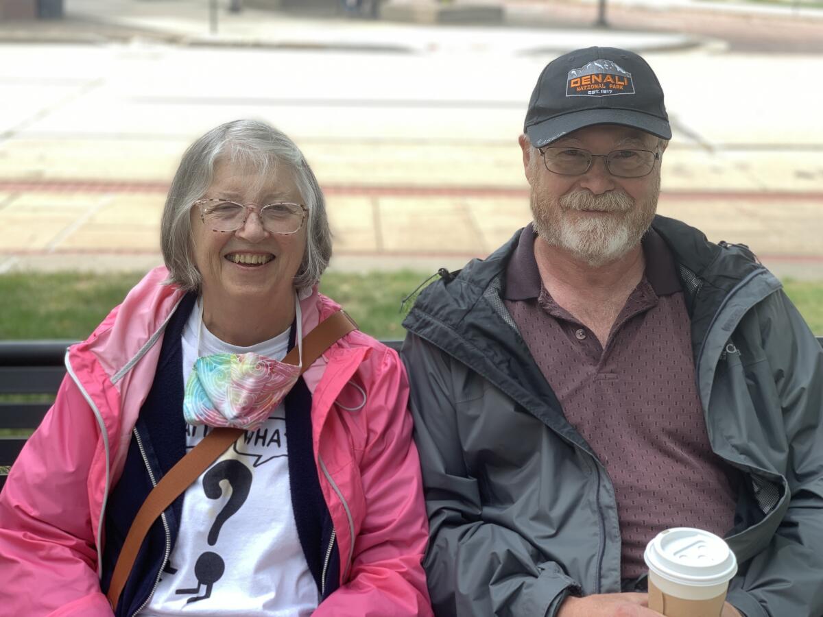 Kate and Barry Yarboro of Oshkosh, Wis., sit on a bench together.