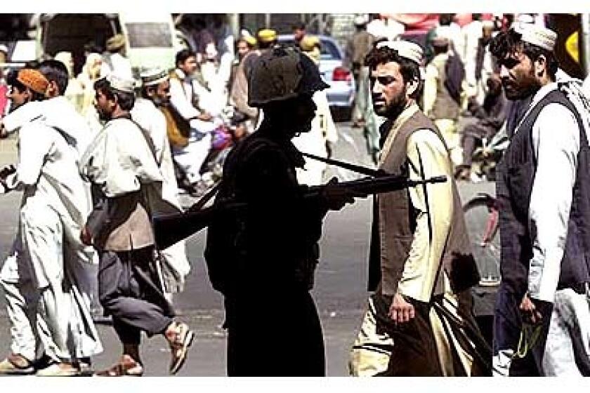 Paramilitary forces patrol in the Pakistani city of Quetta, near the Afghan border. Four Taliban supporters were killed in street clashes with police near the city.