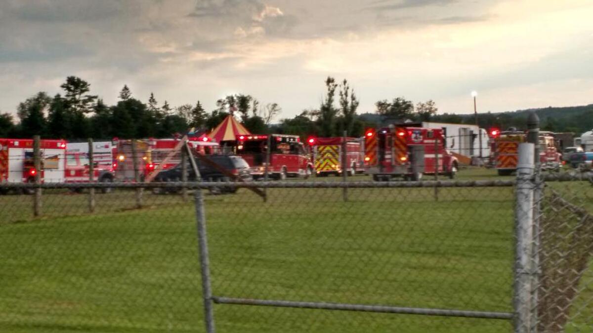 Officers surround the scene of a tent collapse Aug. 3 in Lancaster, N.H. Authorities say the circus tent collapsed when a severe storm raked the fairground.