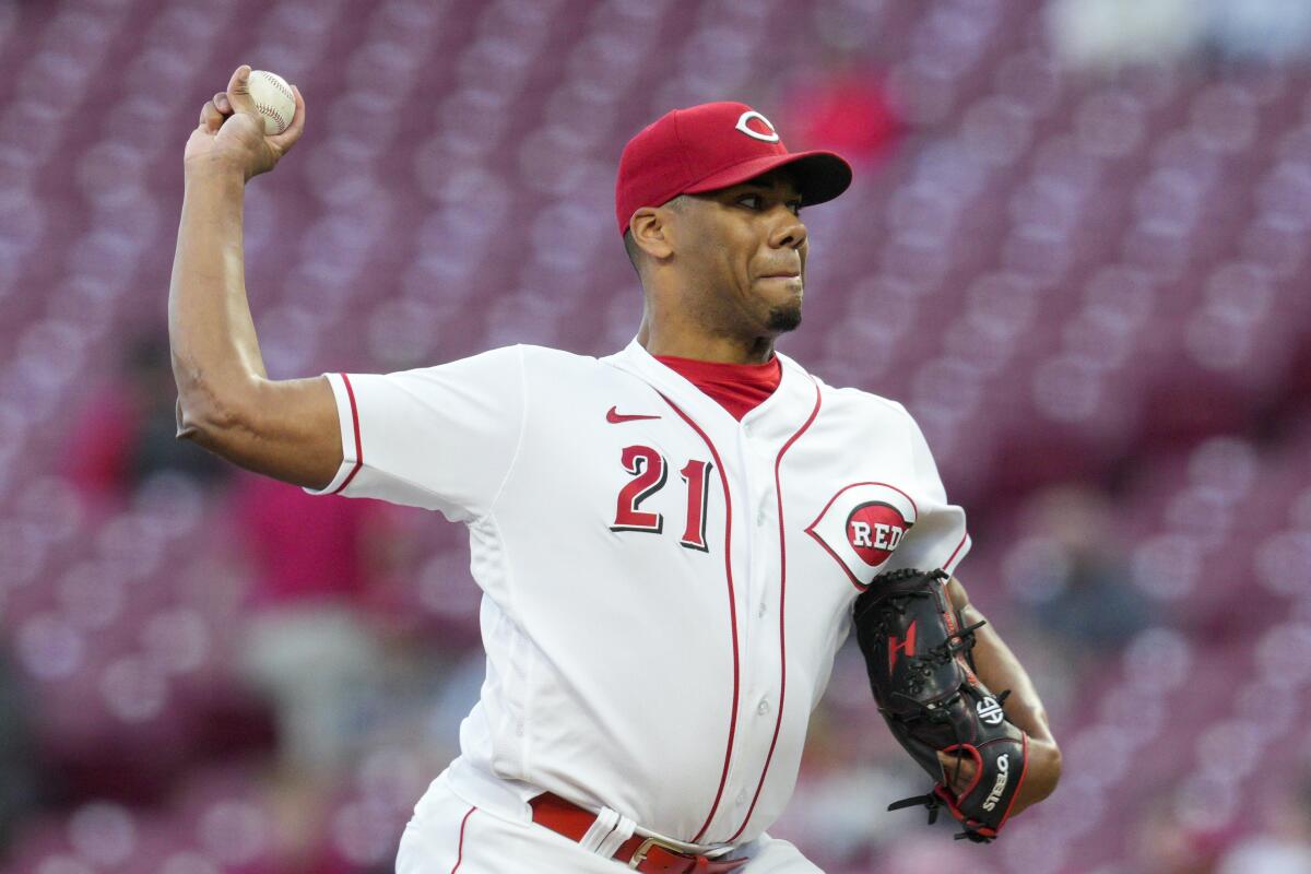 Cincinnati Reds starting pitcher Hunter Greene (21) throws during the first inning of a baseball game against the Chicago Cubs, Monday, Oct. 3, 2022, in Cincinnati. (AP Photo/Jeff Dean)