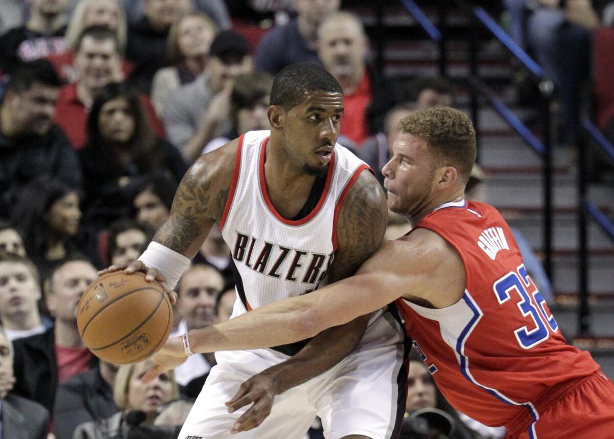 Trail Blazers forward LaMarcus Aldridge, who had 37 points and 12 rebounds, is challenged by Blake Griffin of Clippers, who prevailed at Portland.