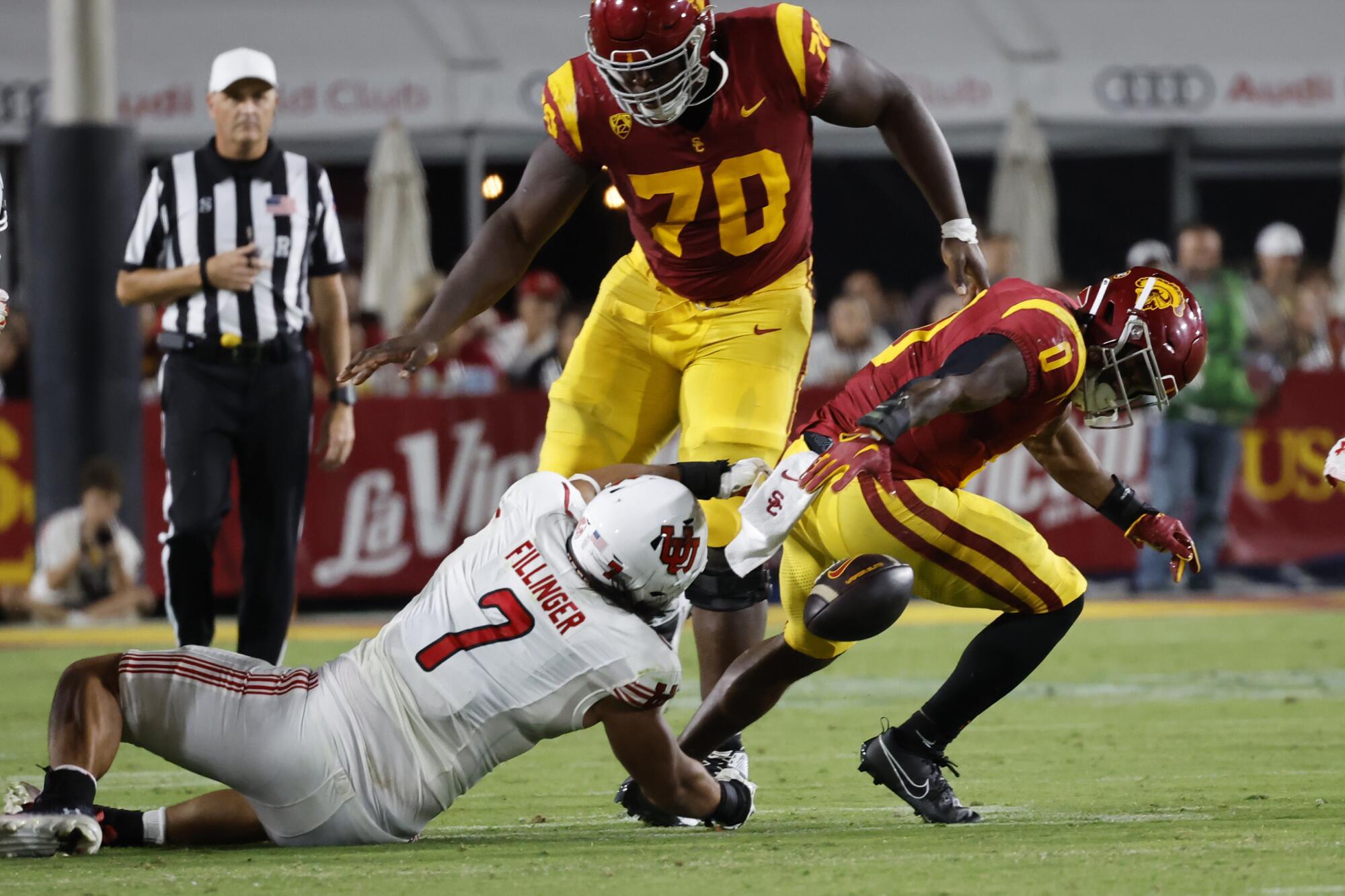 USC running back MarShawn Lloyd looks for the ball after it was stripped from him during a rushing play