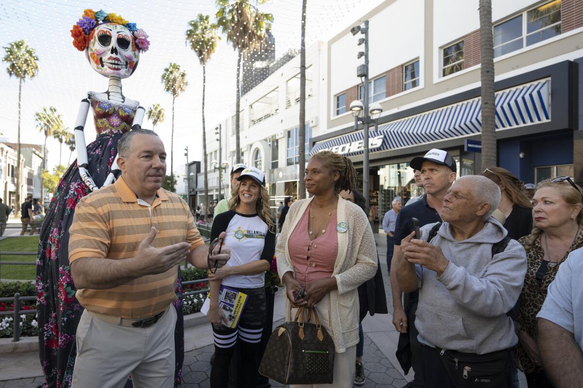 Los Angeles County Sheriff Alex Villanueva interacts with people at the Third Street Promenade