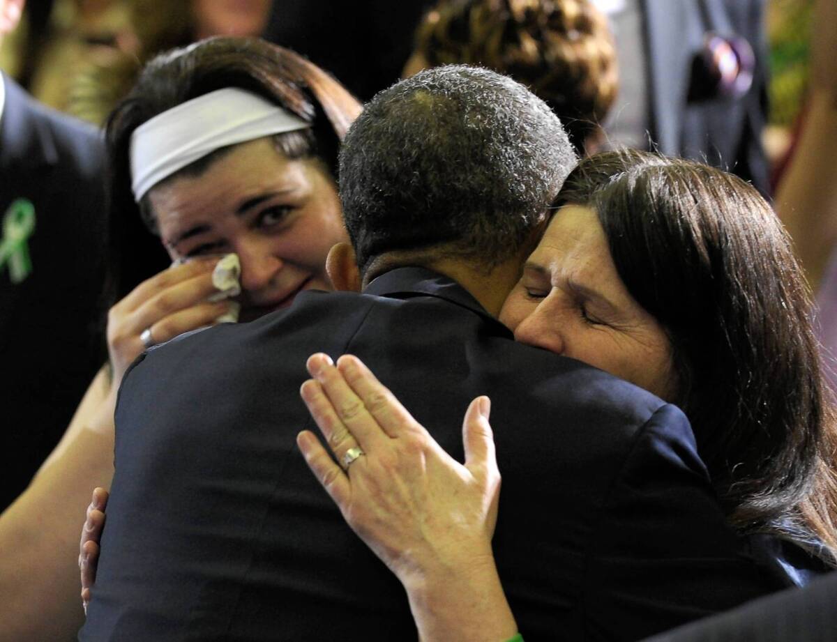 President Obama hugs Newtown family members after speaking in Hartford, Conn. on Monday about the need for greater gun-control laws.