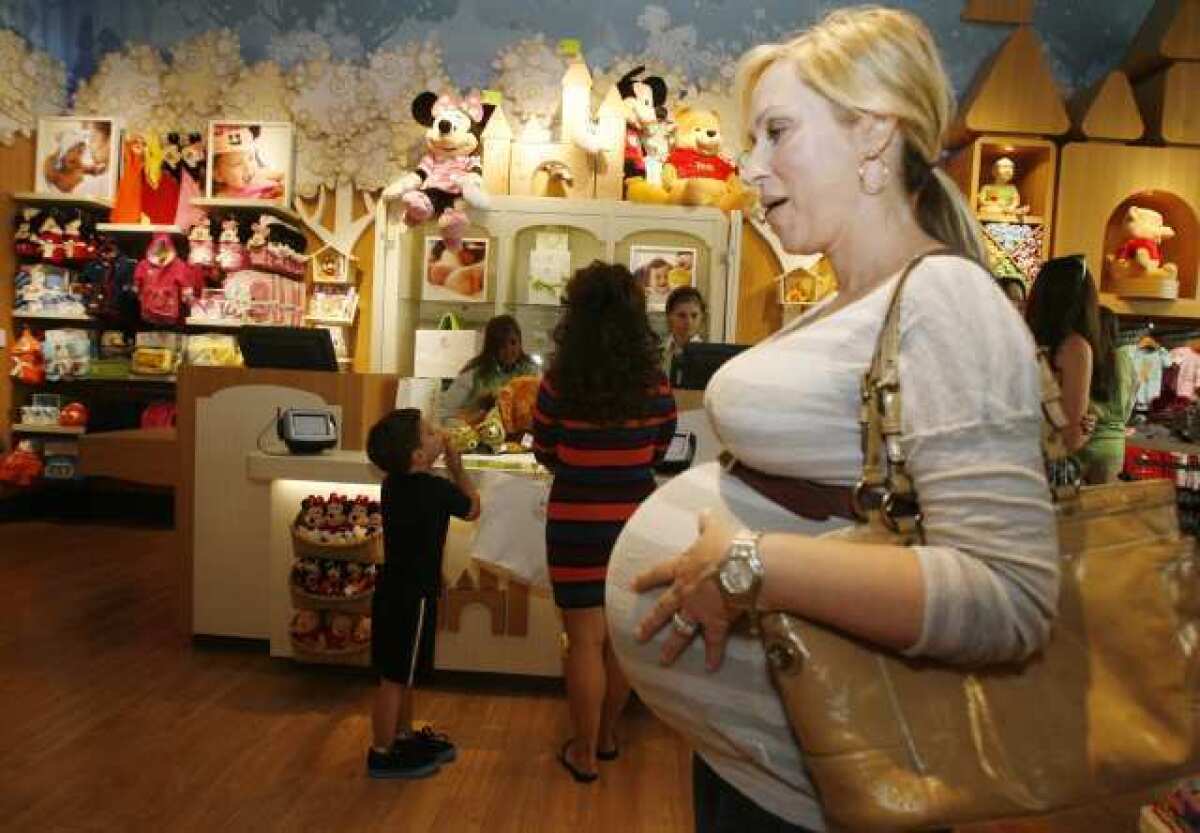 Leigh-Allyn Baker, an actress with Disney's Good Luck Charlie, walks through the newly opened Disney Baby at the Americana at Brand where the store held it's grand opening on Thursday.