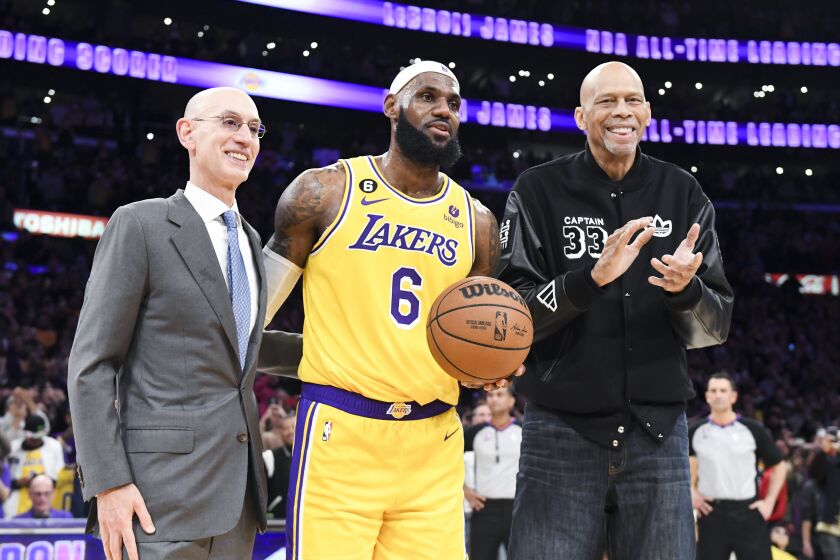 LOS ANGELES, CA - APRIL 29: Adam Silver, from left, poses with LeBron James and Kareem Abdul-Jabbar, after James passes Kareem to become the all-time NBA scoring leader, passing him at 38388 points during the third quarter against the Oklahoma City Thunder at Crypto.com Arena on Tuesday, Feb. 7, 2023 in Los Angeles, CA. *Wally Skalij / Los Angeles Times)