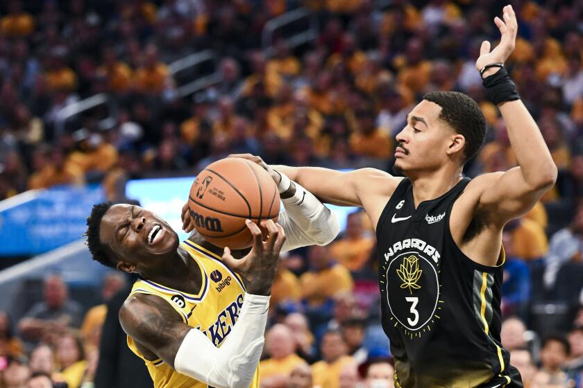 San Francisco, CA - MAY 02: Golden State Warriors guard Jordan Poole, right, fouls Los Angeles Lakers guard.