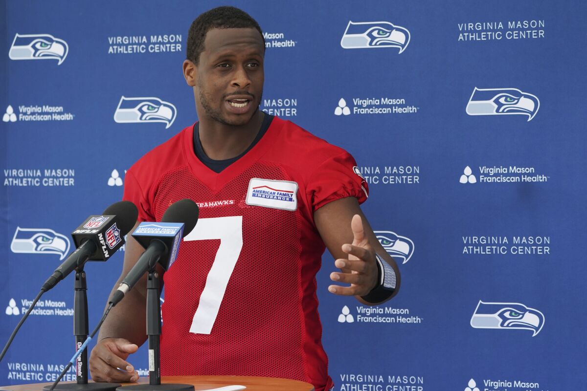 Seattle Seahawks quarterback Geno Smith talks to reporters after NFL football practice Wednesday, June 8, 2022, in Renton, Wash. (AP Photo/Ted S. Warren)