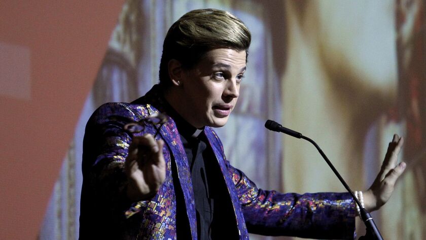 Free speech avatar, or just out for himself? Far-right provocateur Milo Yiannopoulos speaks to a crowd at Cal State Fullerton in 2017.