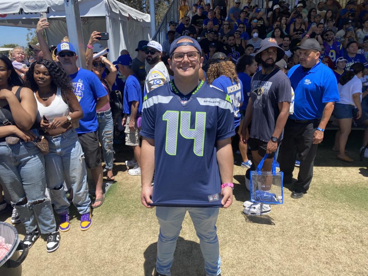 Seattle Seahawks fan Chris Manley (14) poses at the Rams' training camp in Irvine.