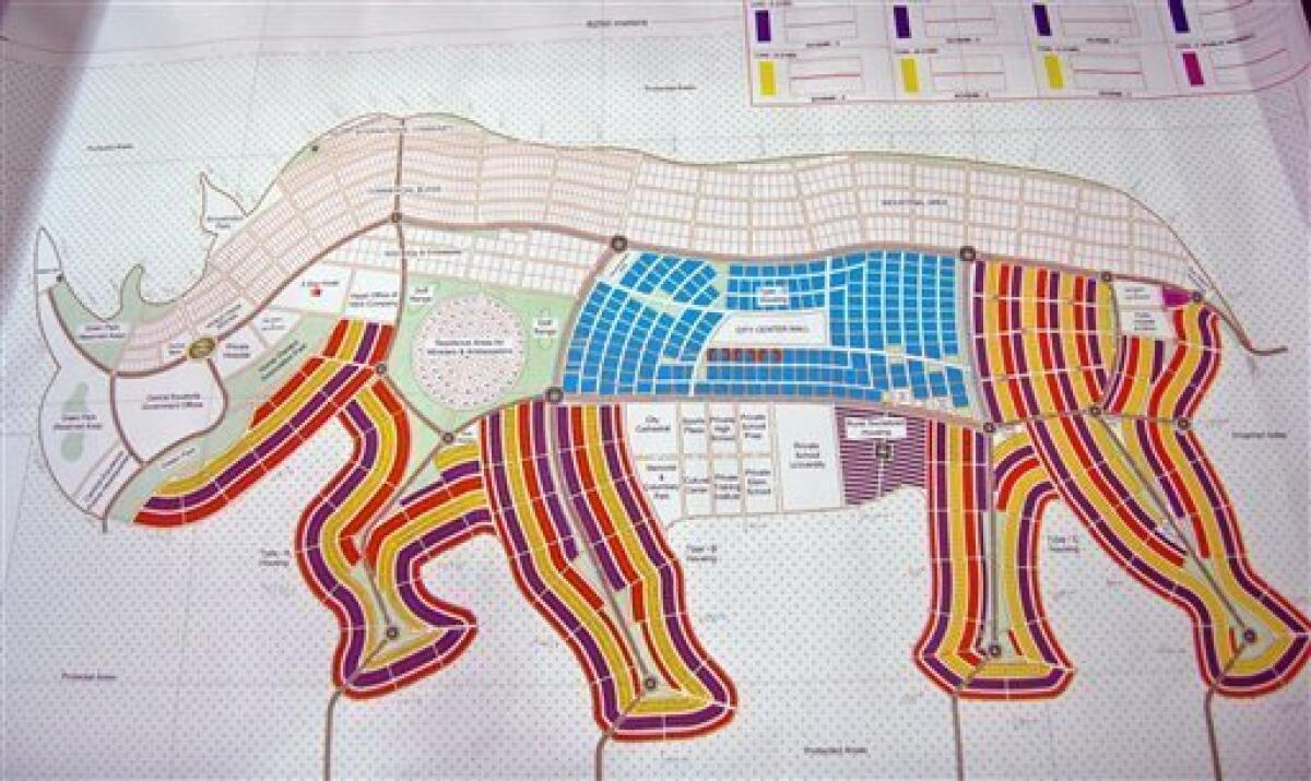 A proposed map of Juba in the shape of an rhino is presented, Wednesday, Aug 18, 2010, in Juba, Southern Sudan. A city shaped like a giraffe? A rhino-shaped town? Even one like a pineapple?Southern Sudan has unveiled ambitious plans to remake its capital cities in the shapes found on their state flags, and an official says the government is talking with investors to raise the $10 billion the fanciful communities would cost.(AP Photo/Pete Muller)