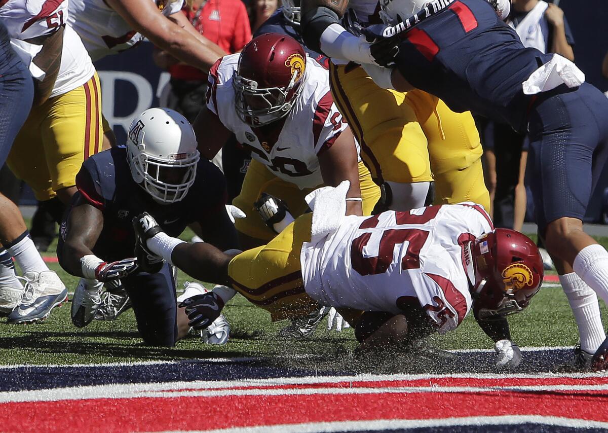 USC running back Ronald Jones II (25) crashes into the end zone for a touchdown during the first half of a game against Arizona on Oct. 15.