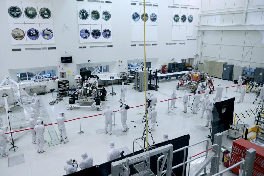 Media toured the Spacecraft Assembly Facility clean room where NASA's next spacecraft headed to the Red Planet is being built, at the Jet Propulsion Laboratory in La Canada Flintridge on Friday, Dec. 27, 2019. The rover was constructed in the clean room and is undergoing final testing. The rover, its rocket-powered descent stage and the mission's cruise stage was on display.
