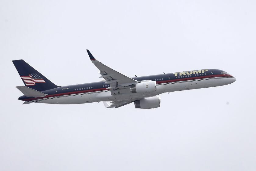 Former president Donald Trump's Boing 757 does a fly-over to a rally in Anaheim, on day one of the Pacific Airshow in Huntington Beach on Friday.