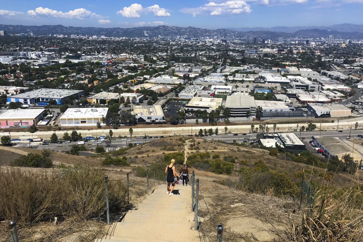A look out from the top of a staircase shows a view of L.A,