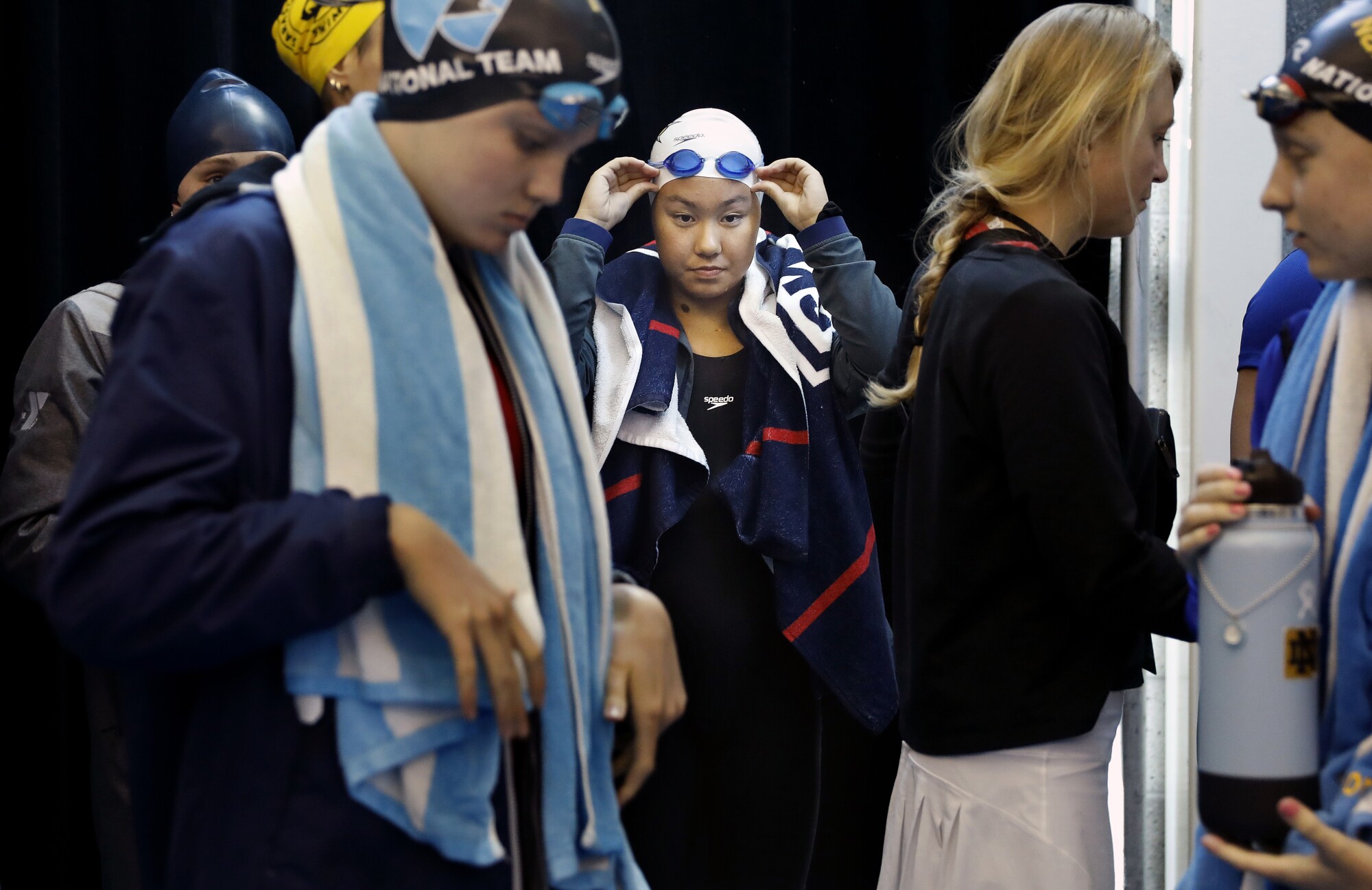 Kayla Han prepares to walk out to the pool during the 2022 Phillips 66 International Team Trials