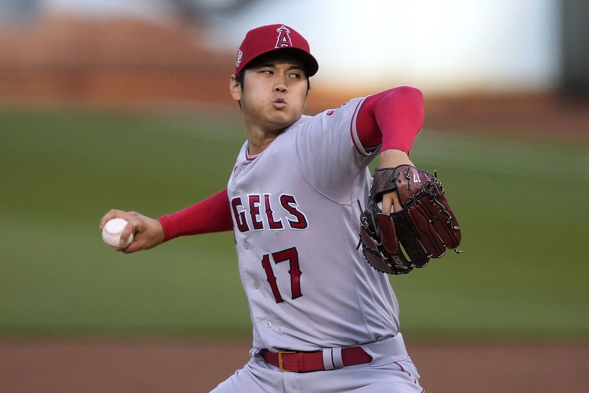 Los Angeles Angels pitcher Shohei Ohtani throws to an Oakland Athletics batter.