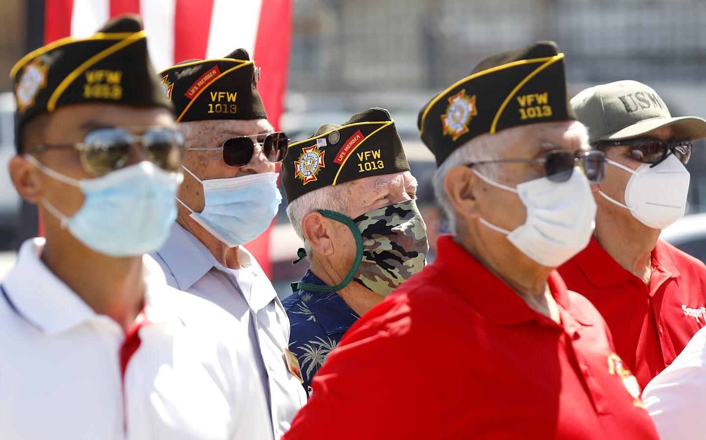 Veterans wear masks during a Memorial Day ceremony at Los Cinco Puntos/Five Points Memorial in East Los Angeles on Monday.