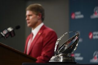 Kansas City Chiefs owner Clark Hunt speaks near the Lamar Hunt Trophy after the NFL AFC Championship playoff football game against the Cincinnati Bengals, Sunday, Jan. 29, 2023, in Kansas City, Mo. The Kansas City Chiefs won 23-20. (AP Photo/Jeff Roberson)