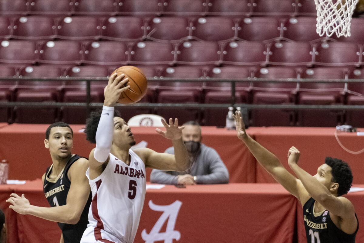 Alabama guard Jaden Shackelford goes up for a shot against Vanderbilt on Feb. 20, 2021.