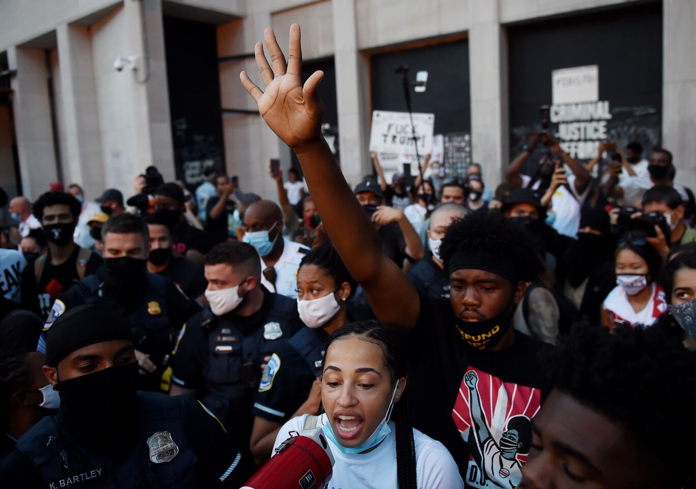 Demonstrators rally against President Trump.