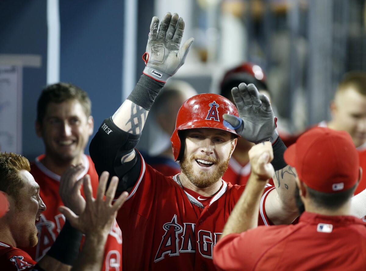 Josh Hamilton, shown celebrating a solo home run with his Angels teammates in August, might have many supporters within the organization, but owner Arte Moreno doesn't seem to be one of them.