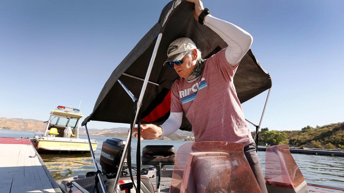 Dan Curtis, who has been fishing Castaic Lake since 1985, prepares his boat for launch June 15 in this state water reservoir in the Santa Clarita Valley.