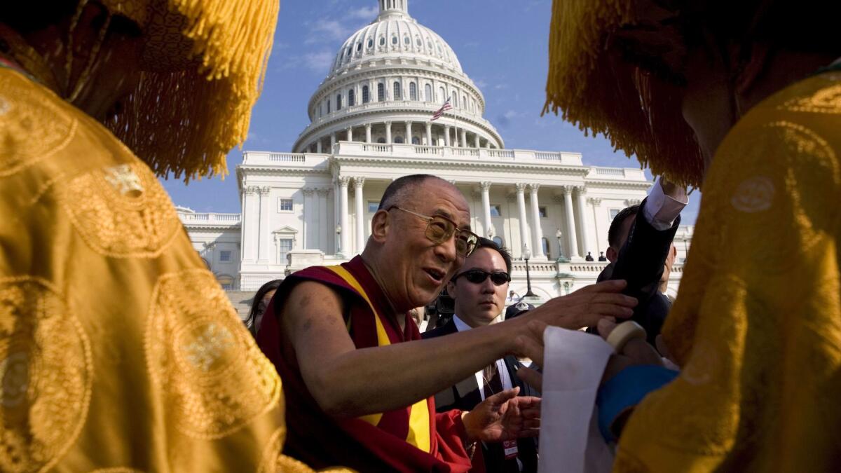 The 14th Dalai Lama of Tibet appears at the U.S. Capitol building during his visit to the United States in 2007.