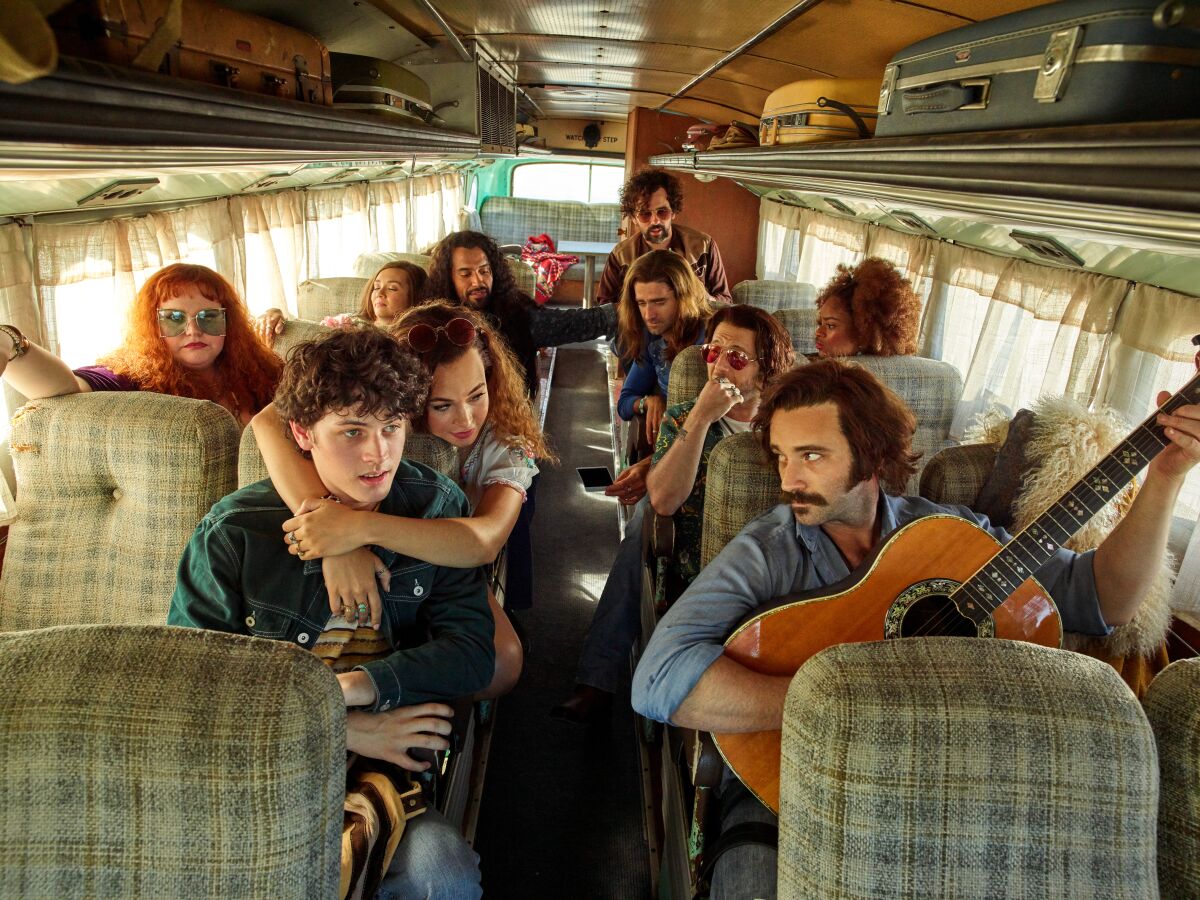 The cast of the Old Globe Theatre's world-premiere musical "Almost Famous," aboard a vintage bus in San Diego.
