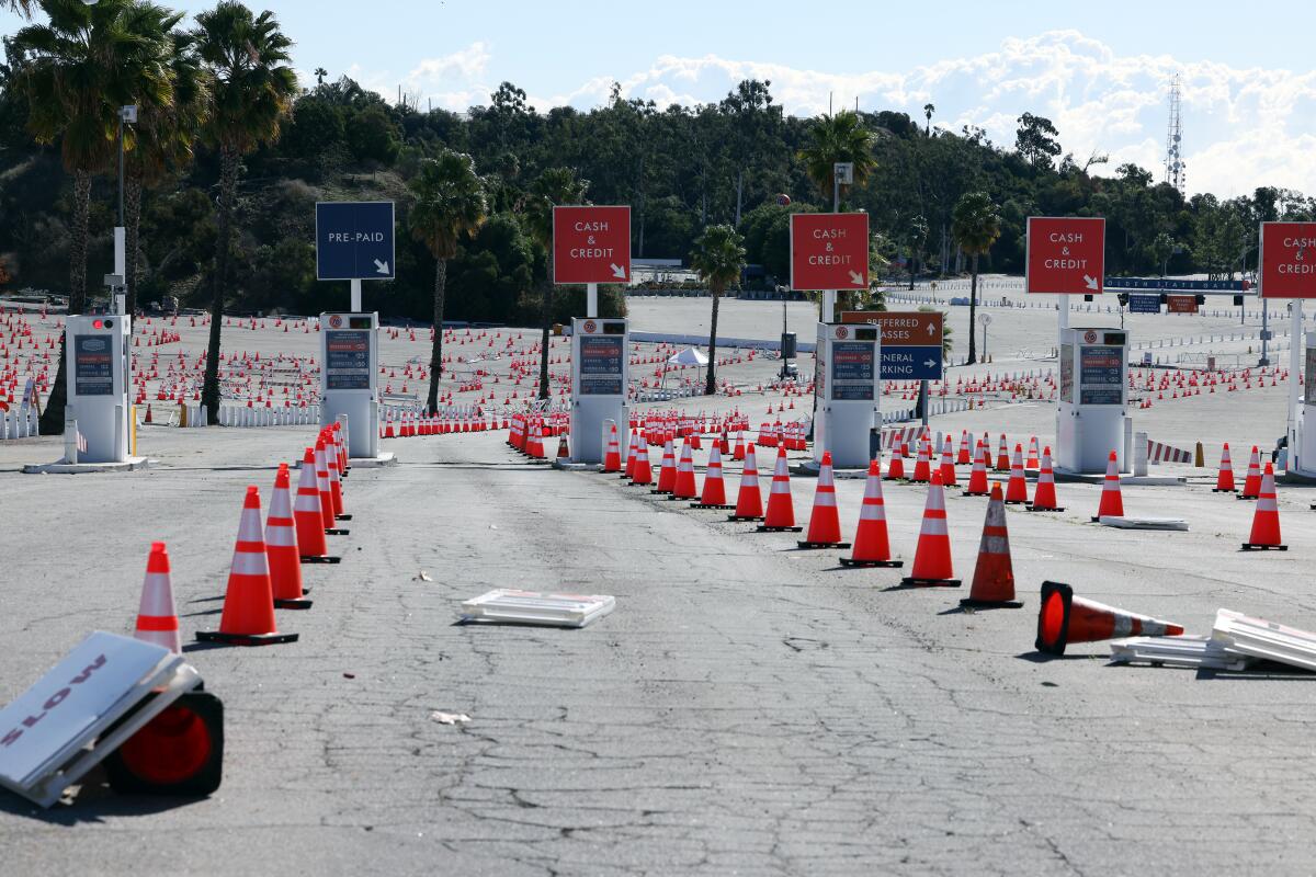 traffic cones litter an empty parking lot