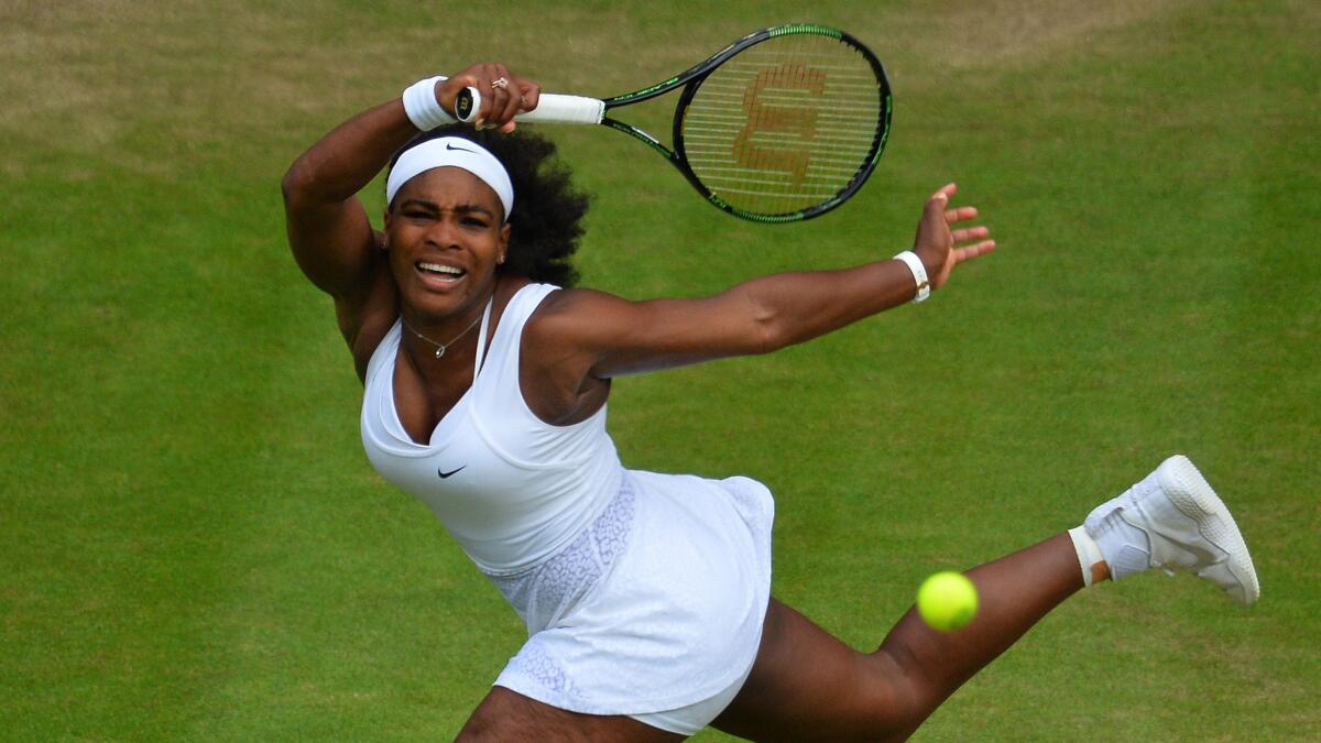 Serena Williams hits a return during her quarterfinal victory over Victoria Azarenka at Wimbledon on Tuesday.