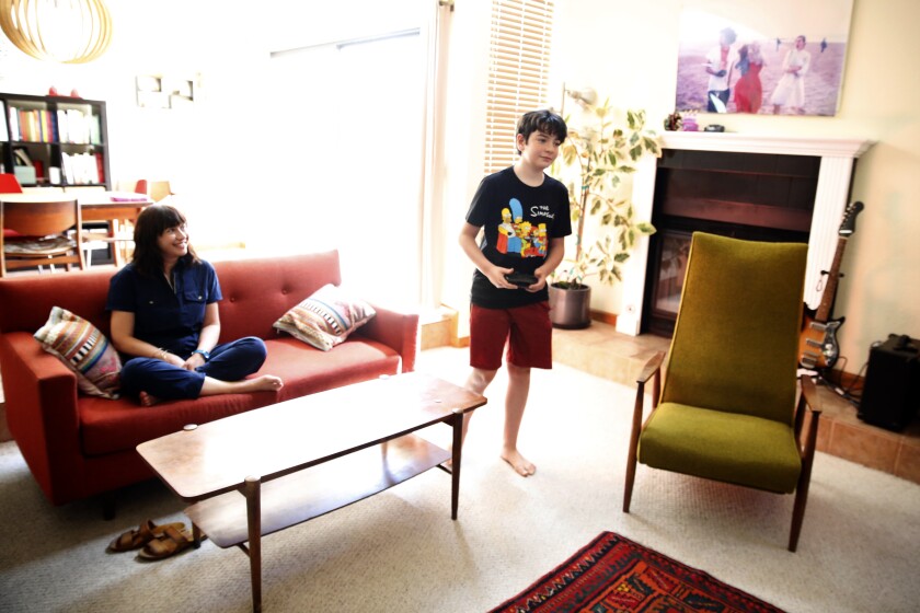 Deborah Netburn and her son play the video game Undertale at their home in Los Angeles.