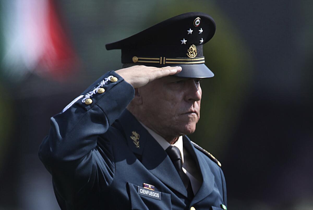 A Mexican military officer in uniform salutes