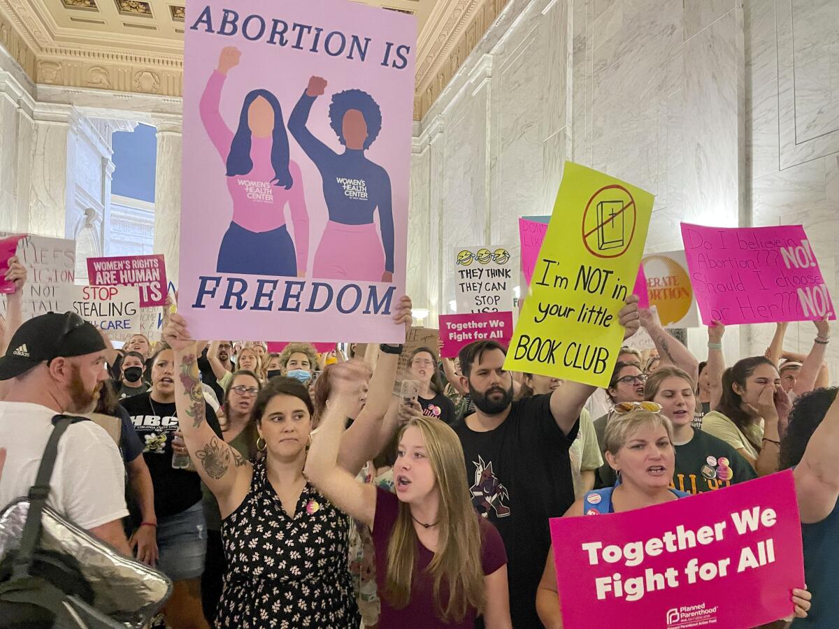 Abortion rights protesters chant outside of the West Virginia Senate chambers prior to a vote on an abortion bill, Friday, July 29, 2022, in Charleston, W.Va. (AP Photo/John Raby)