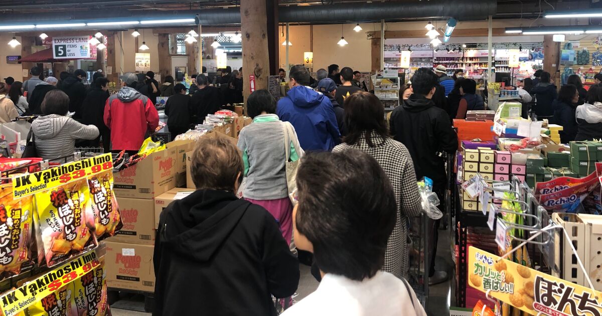 Shoppers standing in lines