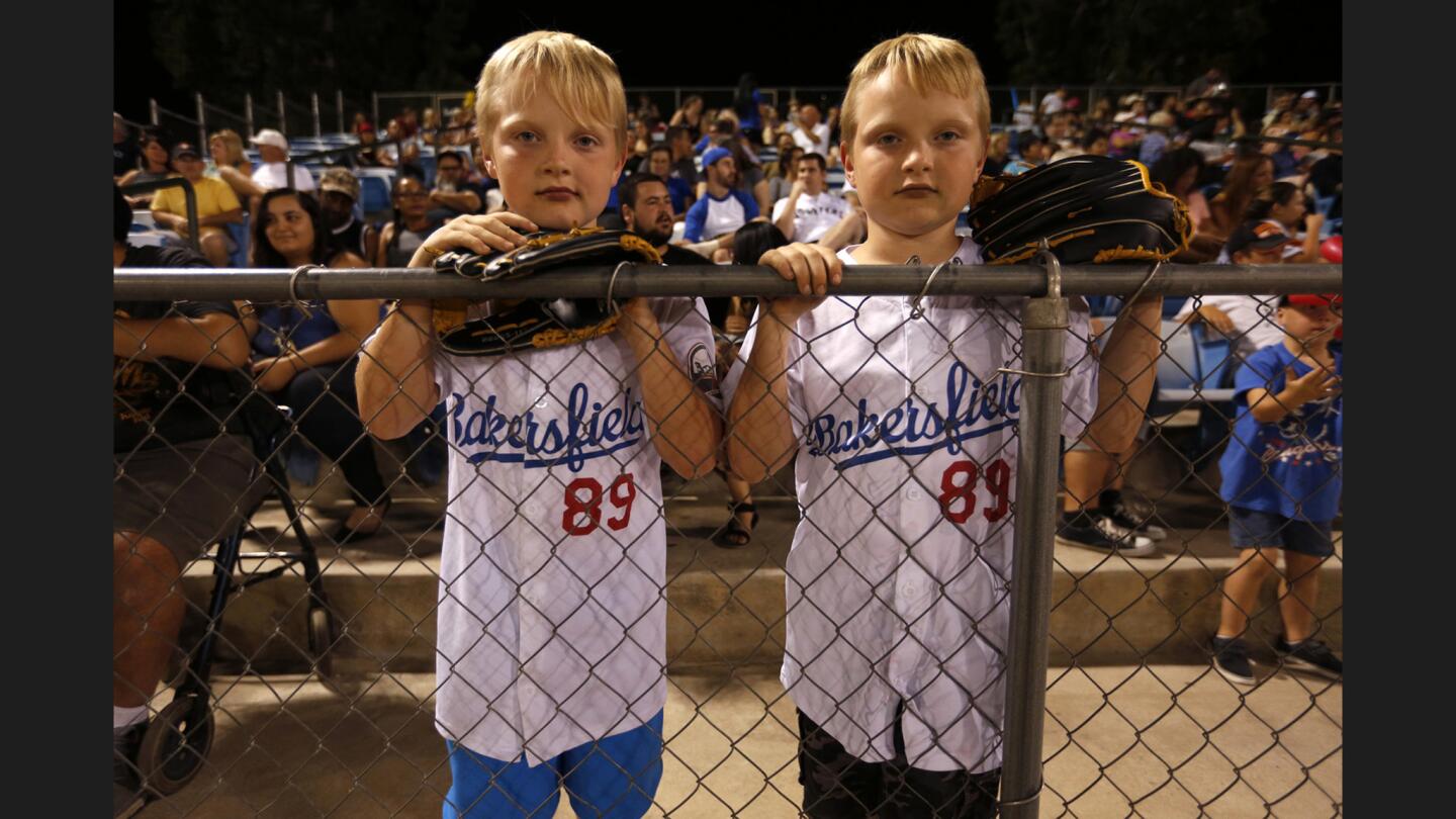 Eight-year-old twins Nathan, left, and Jonathan Vendsel, attend a Blaze game against the Stockton Ports on Aug. 26.