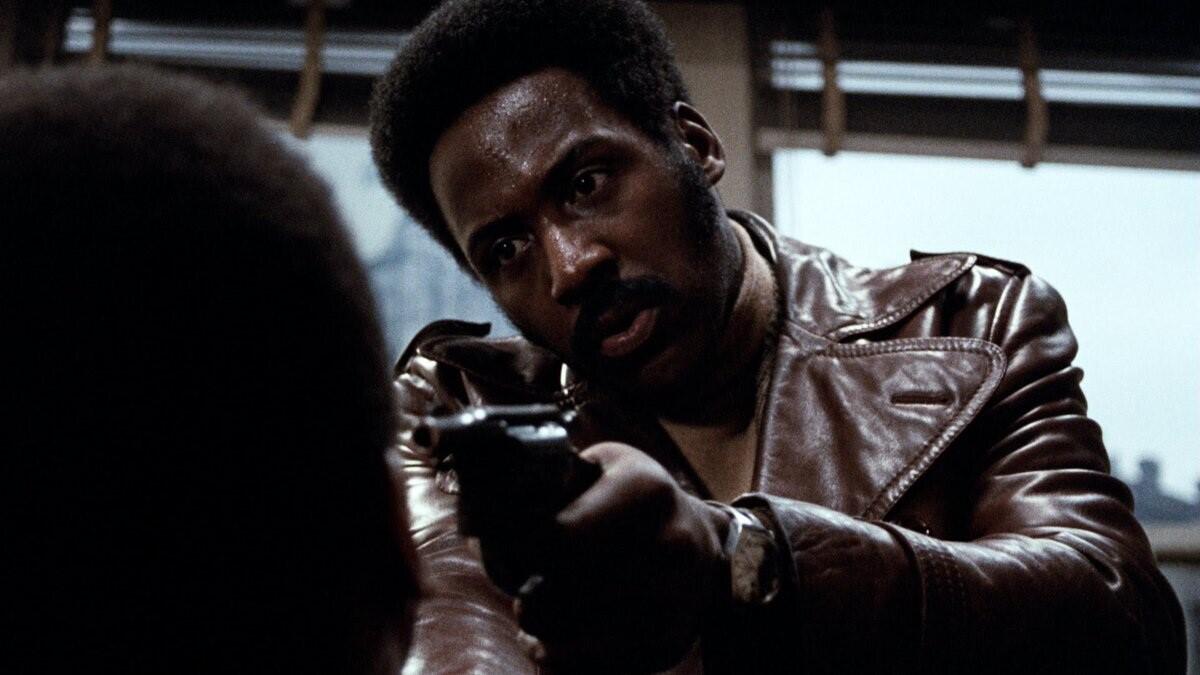 Shaft, holding a gun, means business in a scene from "Shaft."