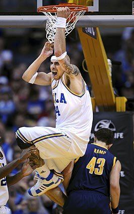 Lorenzo Mata-Real put an exclamation mark on a dunk over Cal's Harper Kamp during Thursday afternoon's Pac-10 Tournament quarterfinal game at Staples Center. UCLA, which needed a fina-minute rally to beat the Bears by one point on Saturday, won easily, 88-66.