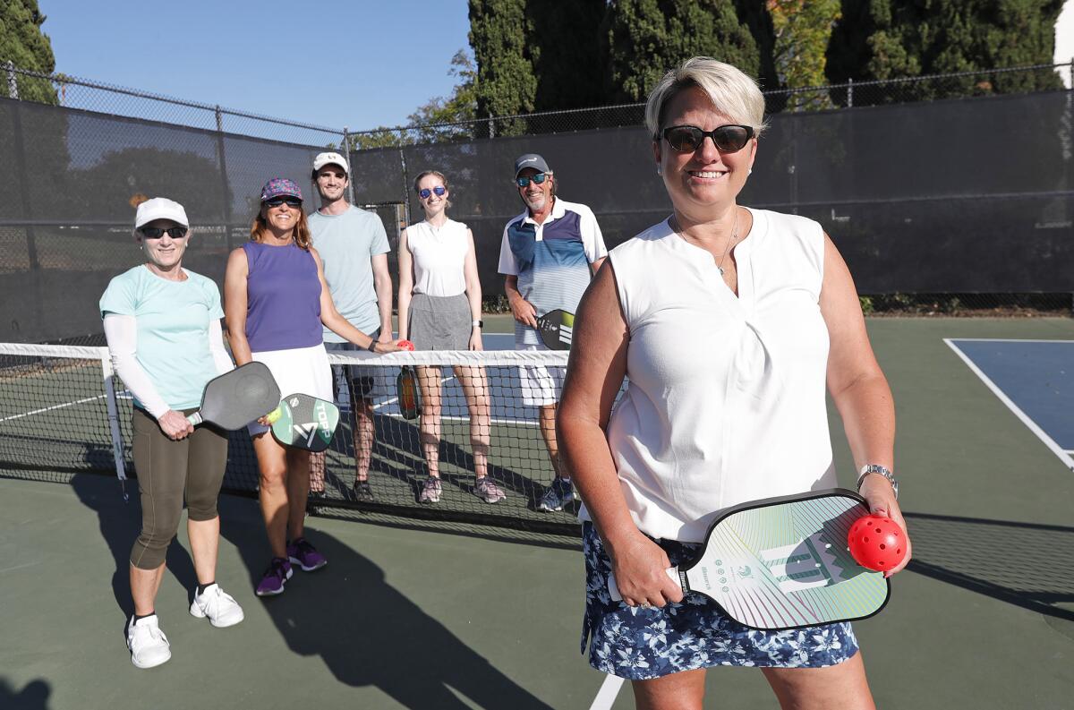 Janice Frechette-Artinger, husband Sam, and pickleball players Danna Kipnis, Wendy Siegel, Kevin Schiavi, Elizah Siegel.