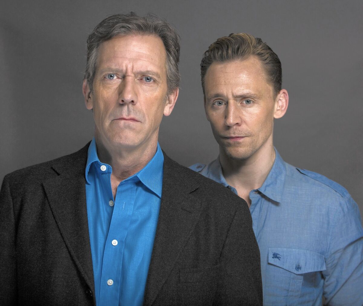 Actors Hugh Laurie, left, and Tom Hiddleston looked to John Le Carré's work as their gospel for the AMC miniseries "The Night Manager."
