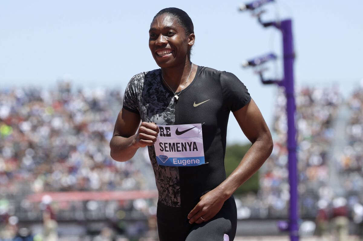 FILE - South Africa's Caster Semenya smiles after winning the women's 800-meter race during the Prefontaine Classic in Stanford, Calif. on June 30, 2019. The Olympic gold medalist is working on a book about her many triumphs as a runner and about her experiences as an intersex woman, including her battles to be eligible for competition because of her naturally high testosterone levels. "Silence All the Noise," which does not yet have a release date, was acquired by W.W. Norton & Company. (AP Photo/Jeff Chiu, File)