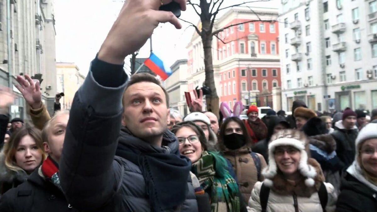 Opposition leader Alexei Navalny takes a selfie during a Moscow rally calling for a boycott of March 18 presidential elections, in this still image taken from AFPTV.