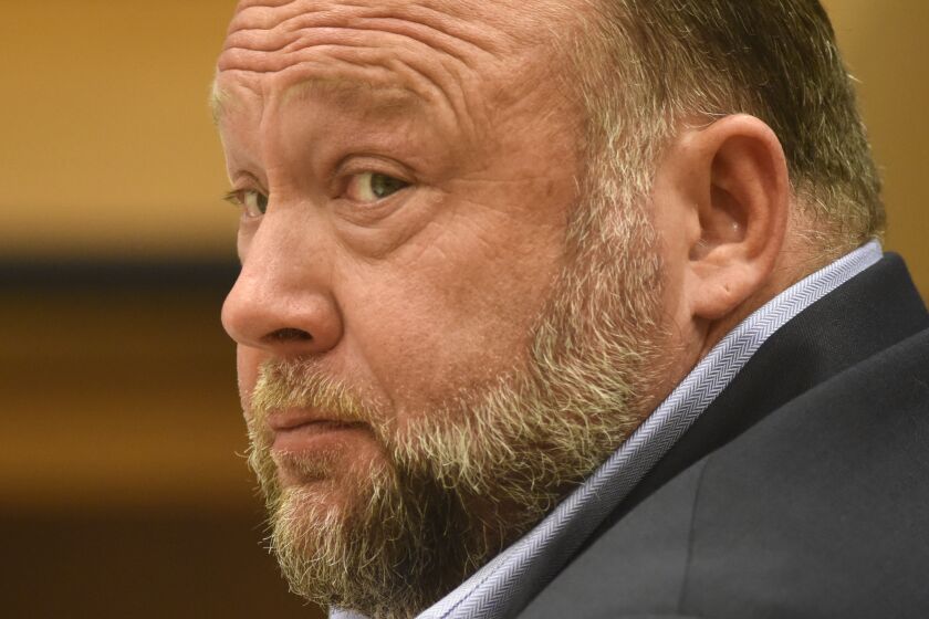 Infowars founder Alex Jones appears in court to testify during the Sandy Hook defamation damages trial at Connecticut Superior Court in Waterbury, Conn. Thursday, Sept. 22, 2022. Jones was found liable last year by default for damages to plaintiffs without a trial, as punishment for what the judge called his repeated failures to turn over documents to their lawyers. The six-member jury is now deciding how much Jones and Free Speech Systems, Infowars’ parent company, should pay the families for defaming them and intentionally inflicting emotional distress. (Tyler Sizemore/Hearst Connecticut Media via AP, Pool)