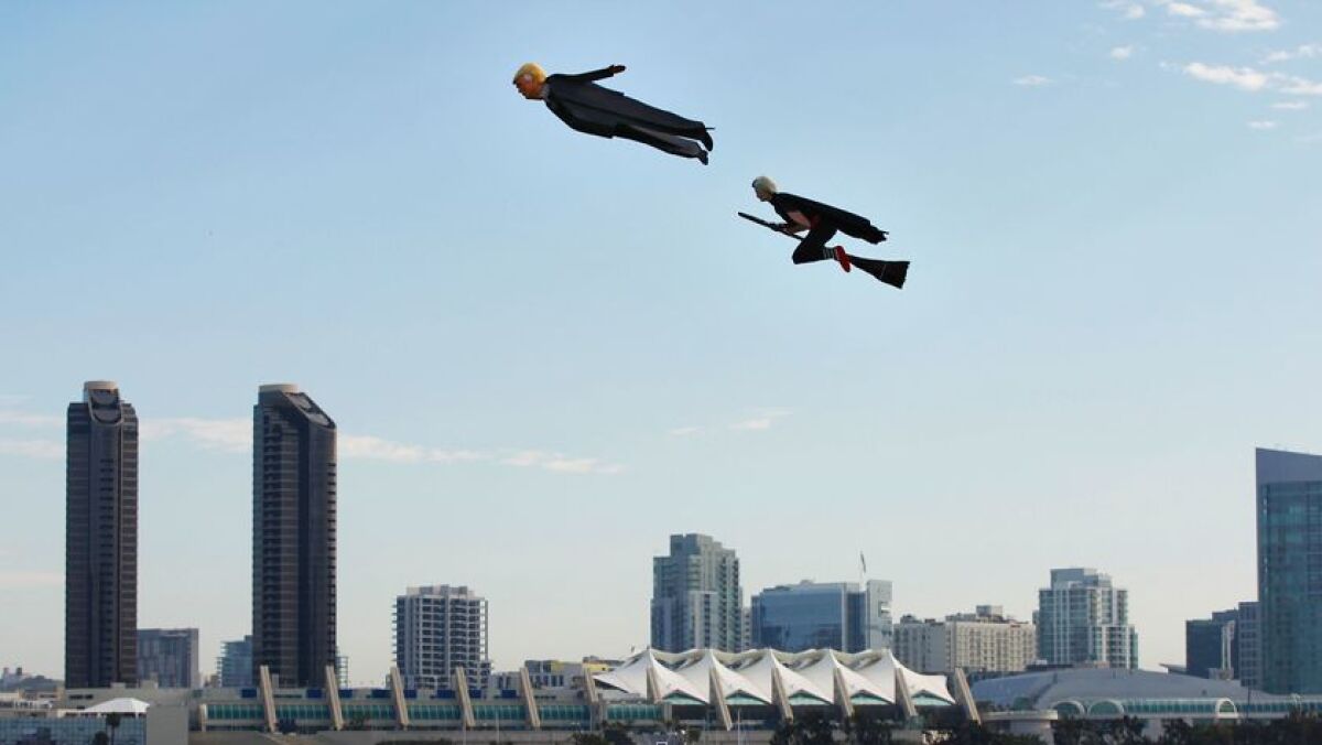 Otto Dieffenbach III flies his Flying Hillary Witch and Donald Moneybags remote-controlled aerial figures at Coronado's Centennial Park.