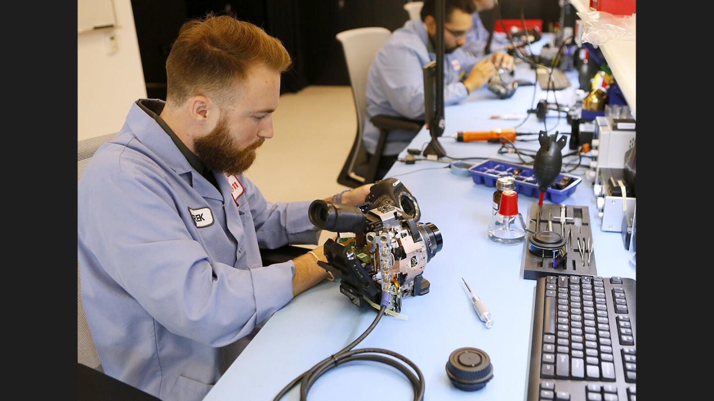 Canon U.S.A. Inc. technicians in the service and support room work on Canon cameras during media open house at the new Burbank technical and service support center location on the 3400 block of W. Olive Ave., in Burbank on Wednesday, July 12, 2017.