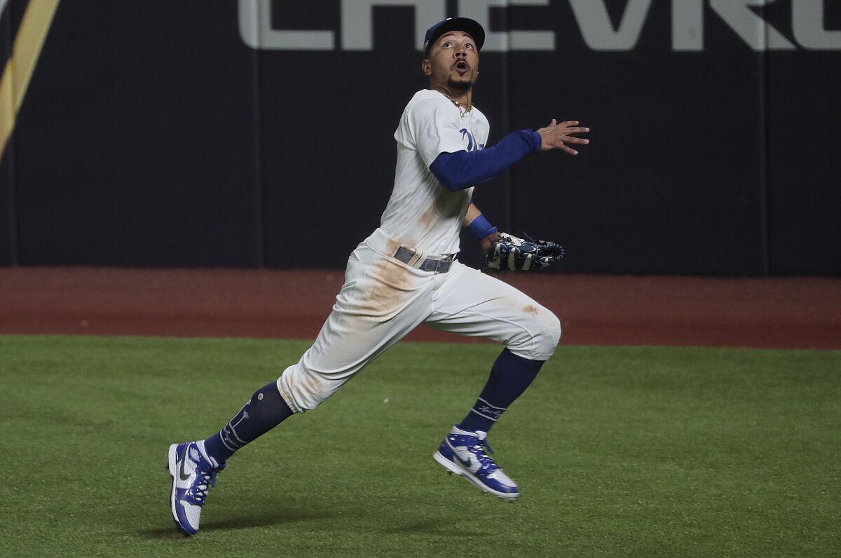 Dodgers right fielder Mookie Betts chases a fly ball during the NLCS against the Atlanta Braves.