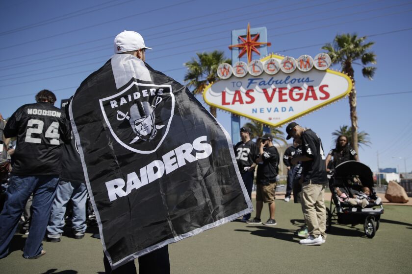 FILE - In this April 29, 2017, file photo, Oakland Raiders fans attend an NFL football draft event in Las Vegas. Tourism officials in Las Vegas are allocating $2.4 million to host the NFL draft in a little more than 10 weeks. The Las Vegas Convention and Visitors Authority board on Tuesday, Feb. 11, 2020, approved a budget for promotions, police, "marquee event elements," and $500,000 for contracts to be signed by the authority chief executive. (AP Photo/John Locher, File)